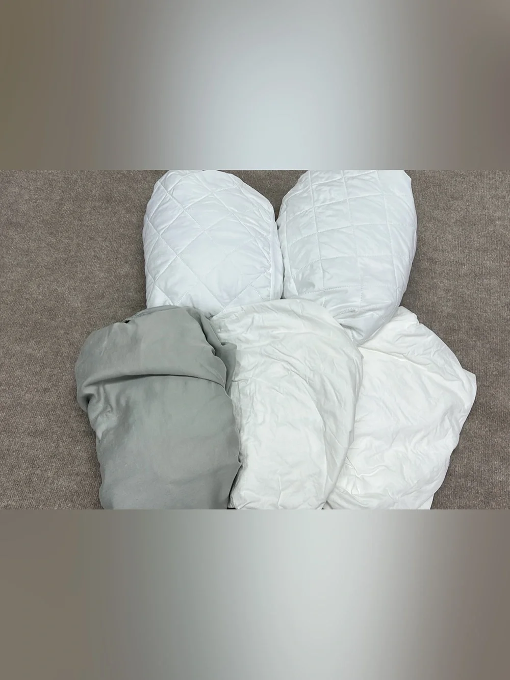Assorted twin sheets and mattress protectors